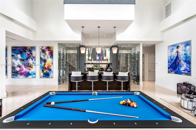 playroom featuring billiards and a towering ceiling