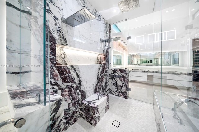 bathroom featuring tile walls and tile flooring