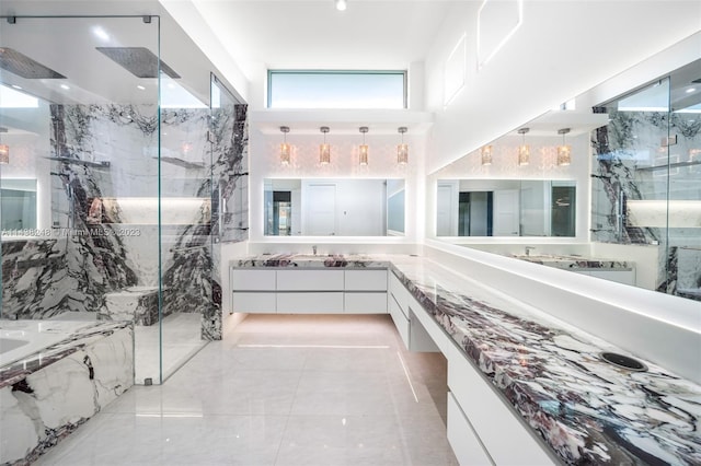 bathroom with vanity, plus walk in shower, tile floors, and a healthy amount of sunlight