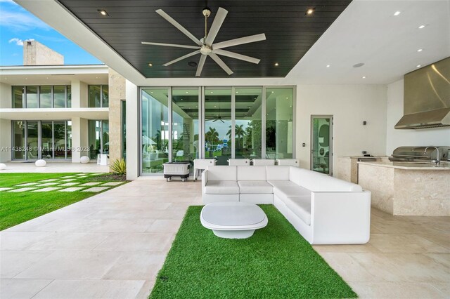 view of patio / terrace with area for grilling, an outdoor living space, and ceiling fan