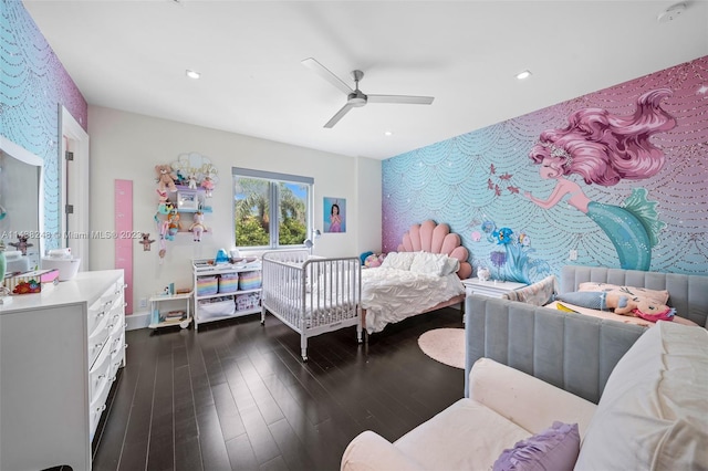 bedroom with dark hardwood / wood-style floors and ceiling fan