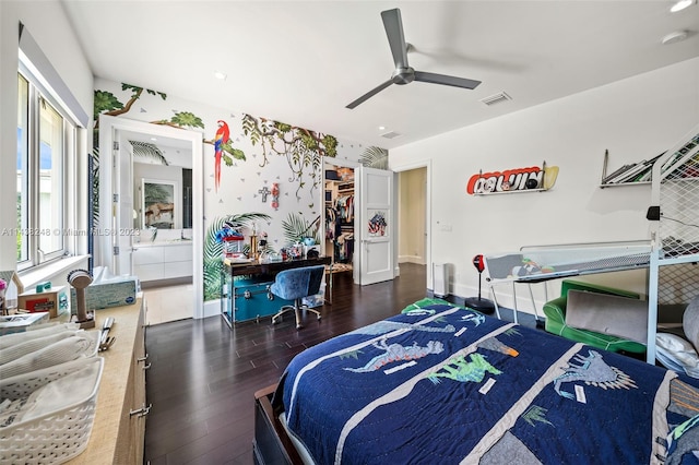 bedroom featuring ensuite bathroom, ceiling fan, a closet, and dark wood-type flooring