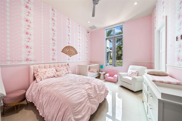 tiled bedroom with ceiling fan