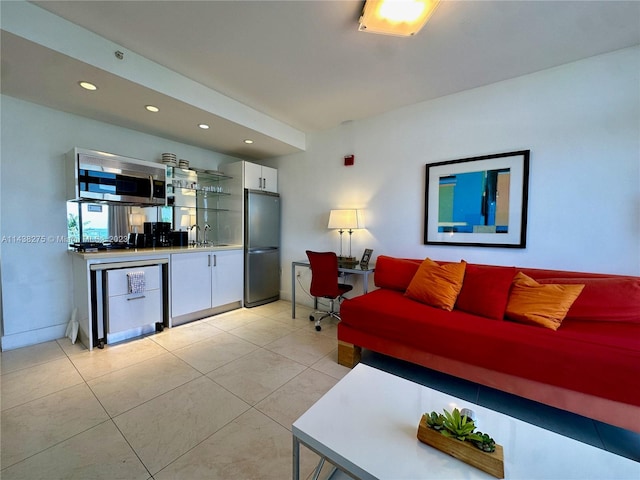 living room featuring sink and light tile floors