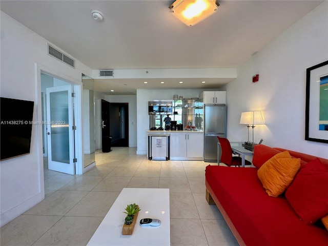 tiled living room with french doors