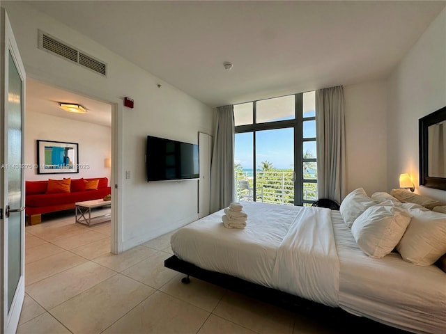 bedroom with light tile floors