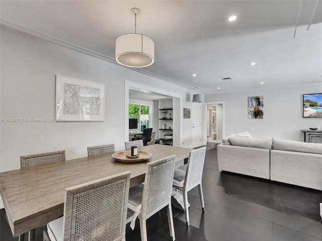 dining area with dark tile patterned floors