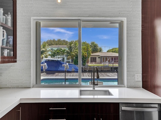 kitchen featuring dishwasher, a healthy amount of sunlight, and sink