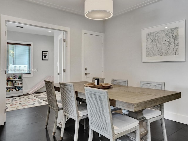 dining space featuring dark hardwood / wood-style floors