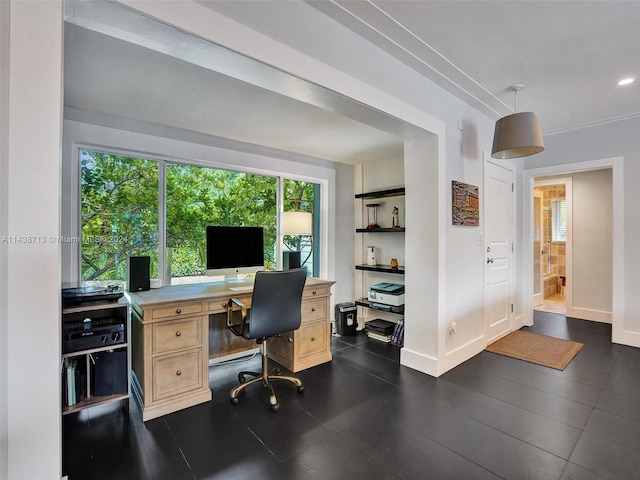 home office with dark tile patterned floors