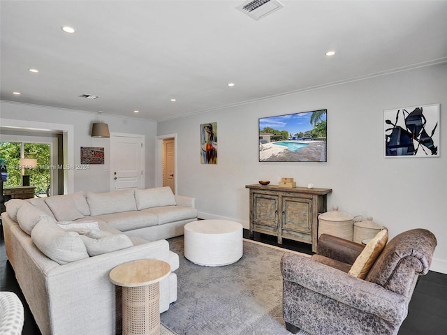 living room featuring ornamental molding and hardwood / wood-style floors