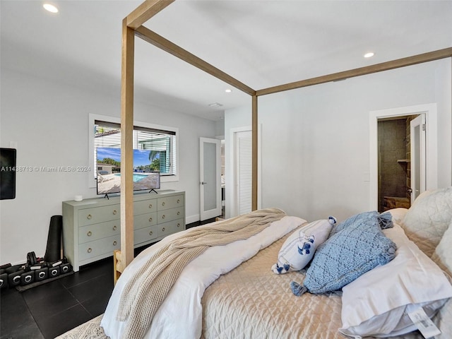 bedroom featuring dark tile patterned floors