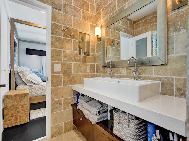 bathroom with vanity, tile walls, and tile patterned flooring