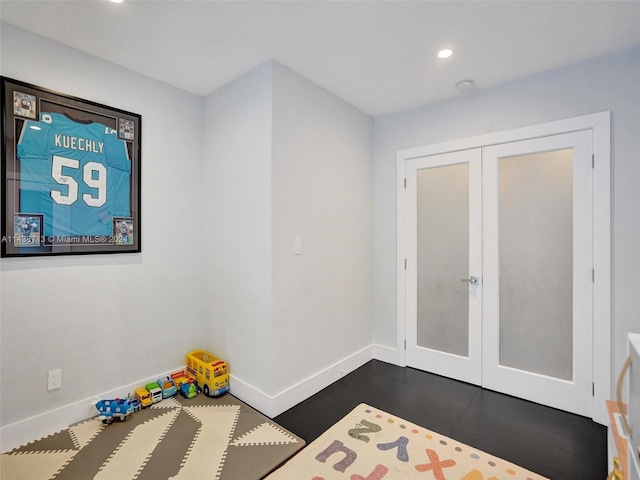 interior space featuring french doors and a closet