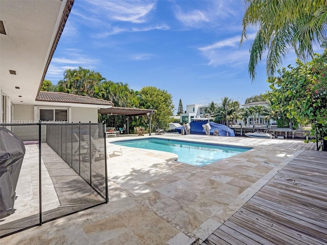 view of swimming pool with a patio