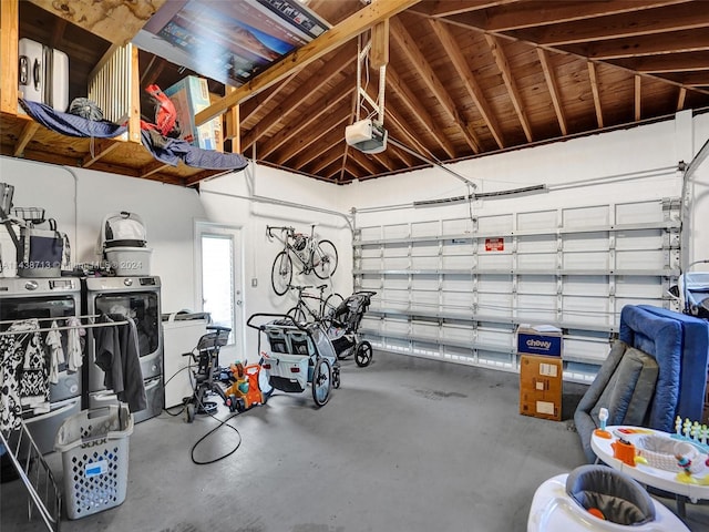 garage with washer / dryer and a garage door opener