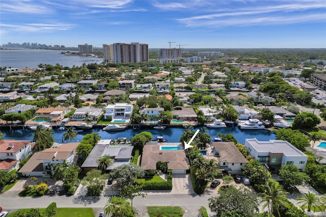 birds eye view of property with a water view