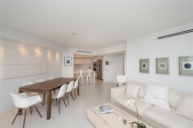 living room featuring light tile flooring