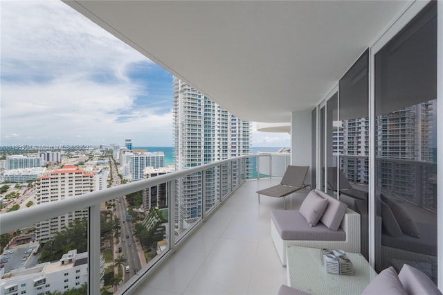 balcony featuring an outdoor hangout area and a water view