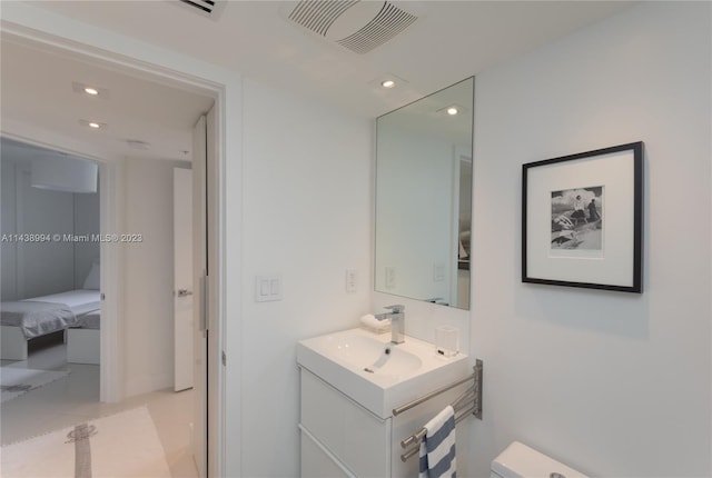 bathroom with vanity and tile flooring