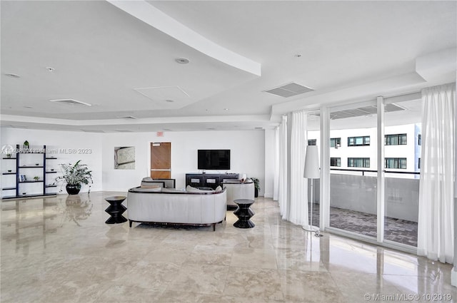 living room with expansive windows and light tile floors