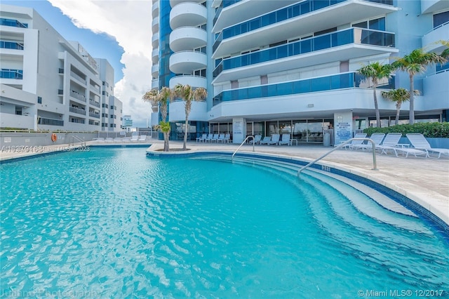 view of swimming pool featuring a patio area