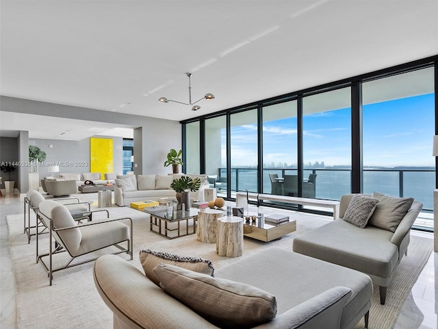 living area featuring expansive windows and a water view