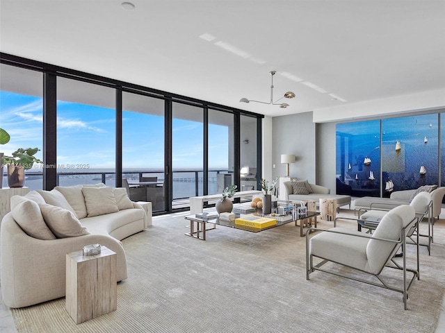 living room featuring a water view and expansive windows