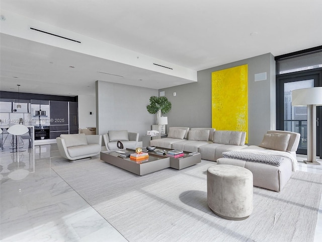 living room featuring marble finish floor