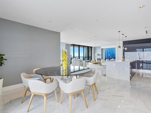 dining space with marble finish floor