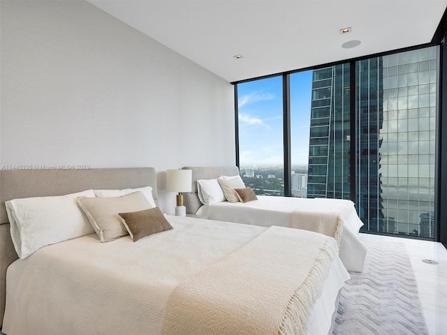 bedroom featuring floor to ceiling windows