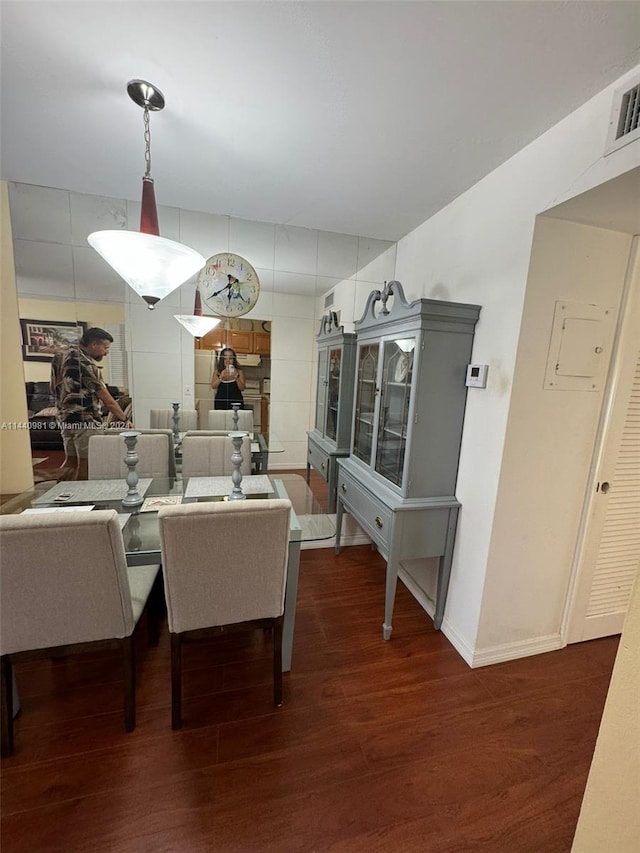 dining room featuring dark wood-type flooring