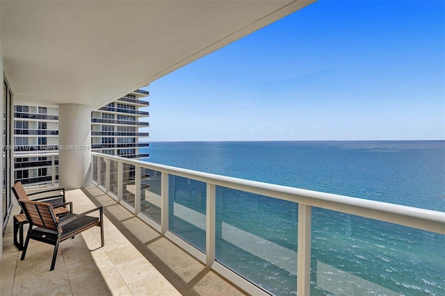 balcony featuring a water view