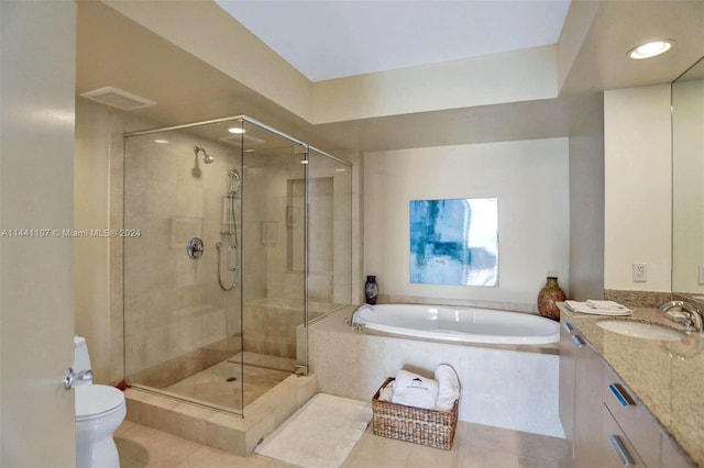 full bathroom with toilet, vanity with extensive cabinet space, shower with separate bathtub, and tile flooring