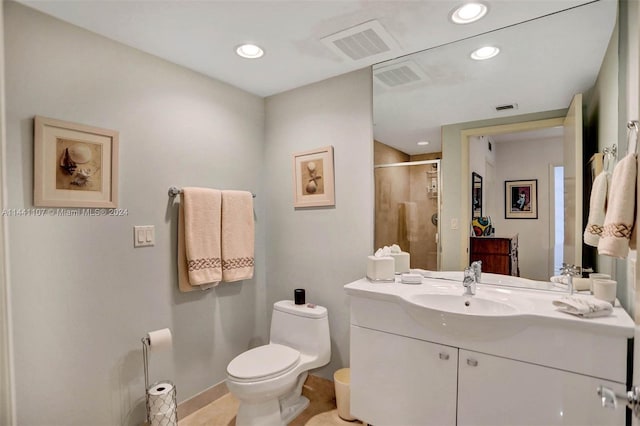 bathroom featuring oversized vanity and toilet