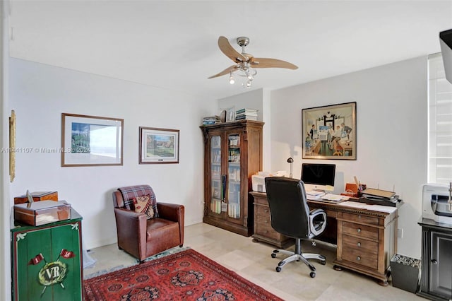 office space with ceiling fan and light tile floors