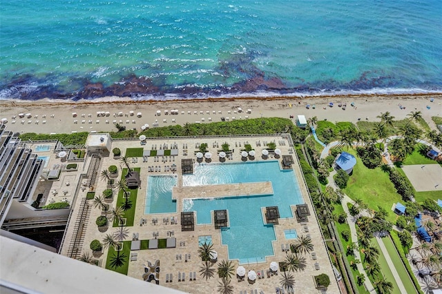 bird's eye view with a water view and a view of the beach