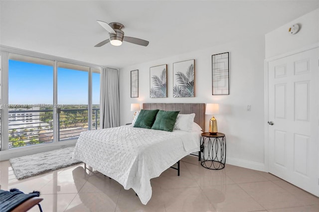 tiled bedroom with ceiling fan