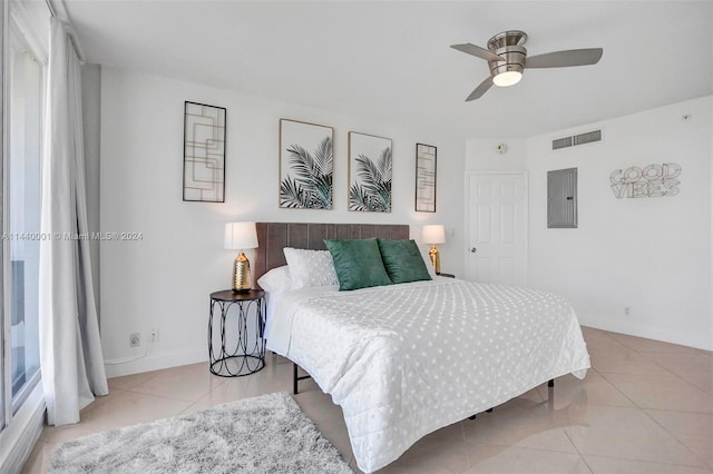 bedroom featuring ceiling fan and light tile floors