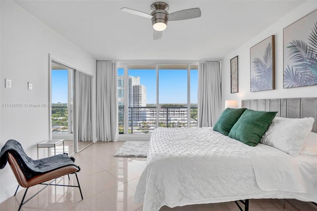 bedroom with access to exterior, ceiling fan, and light tile floors