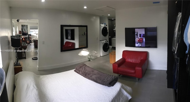 bedroom with stacked washer / drying machine