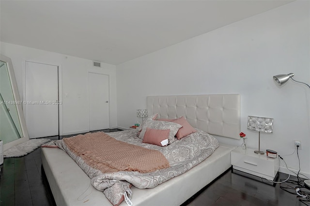 555 NE 15th St Unit 32E, Miami, FL 33132 - bedroom with dark hardwood / wood-style flooring