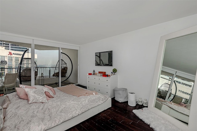 555 NE 15th St Unit 32E, Miami, FL 33132 - bedroom with access to outside and dark wood-type flooring