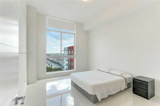 bedroom featuring light tile floors