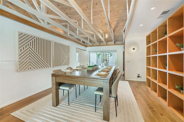 interior space with vaulted ceiling with beams, wood ceiling, and light hardwood / wood-style flooring