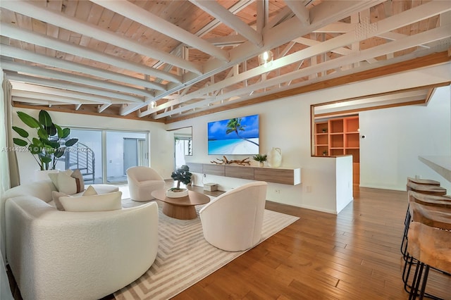 living room with french doors, beamed ceiling, hardwood / wood-style floors, and wood ceiling