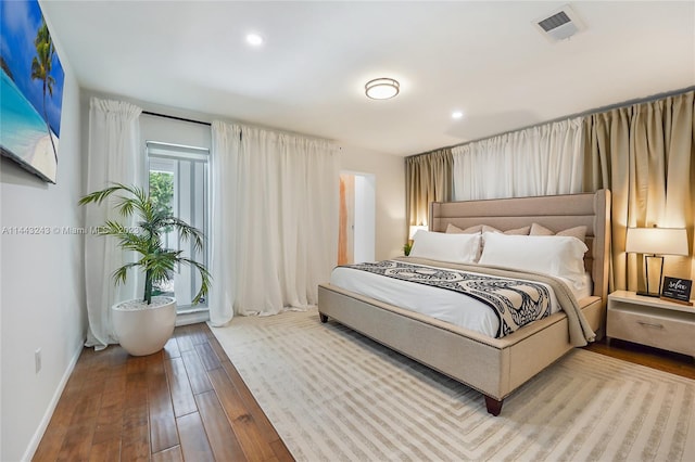 bedroom with hardwood / wood-style flooring