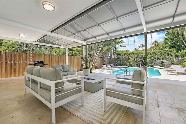 view of patio featuring area for grilling, a fenced in pool, and an outdoor hangout area