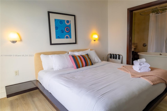 bedroom featuring light hardwood / wood-style floors