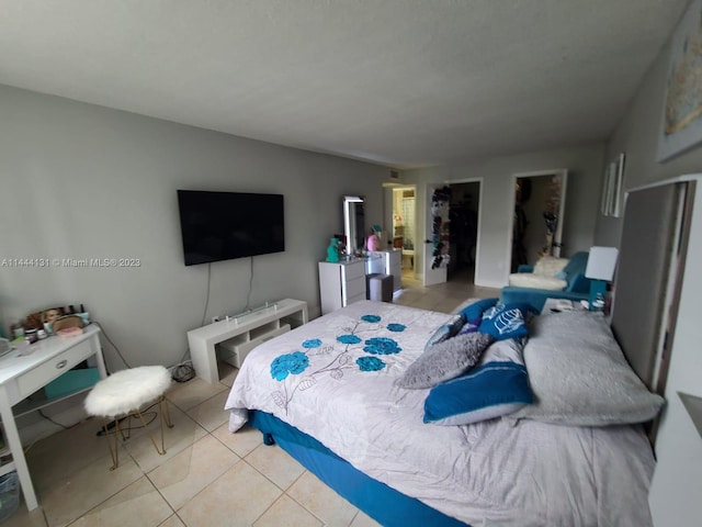 bedroom with light tile flooring